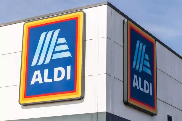 This photo shows a sign reading ALDI on the front of an ALDI store.
