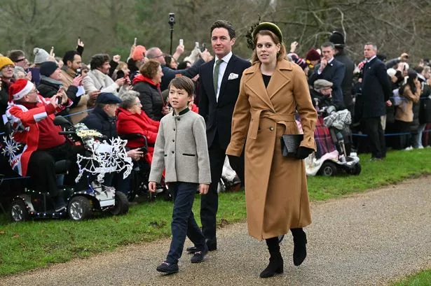 Princess Beatrice of York and her husband Edoardo Mapelli Mozzi wak with his son Christopher Woolf upon arrival to attend the Royal Family's traditional Christmas Day service at St Mary Magdalene Church in Sandringham, 