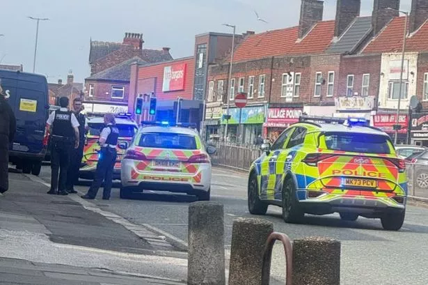 Police at the scene on Prescot Road