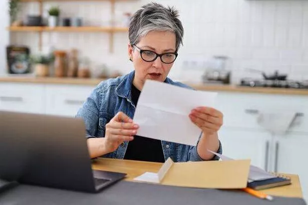 Pensioner checking finances
