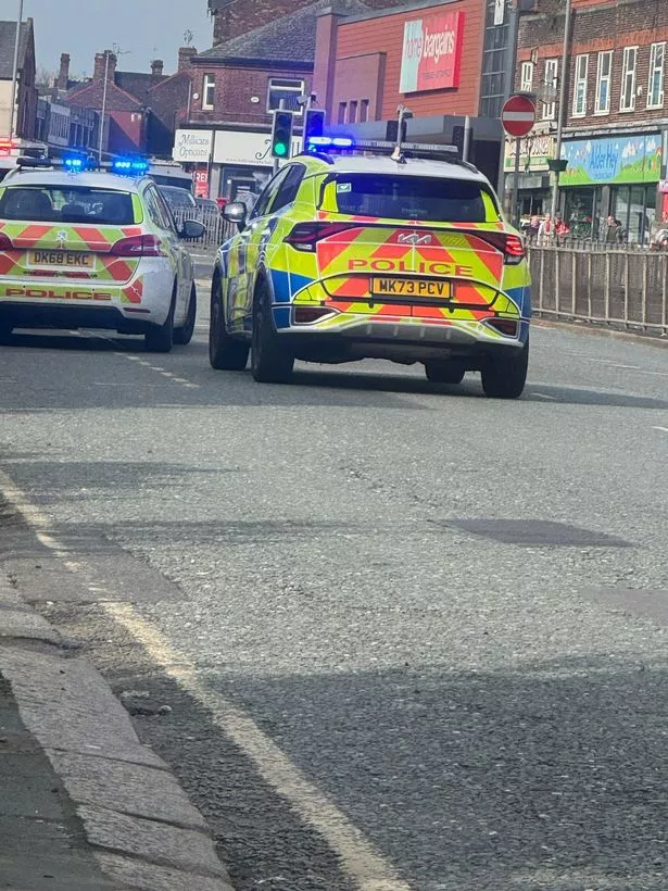 Police at the scene on Prescot Road after robbery at Iceland