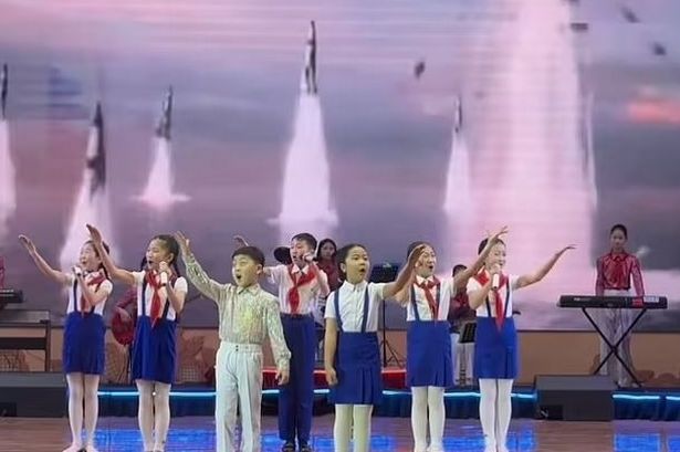 Grab of a travel influencer's video of a "disturbing" school dance performance in North Korea