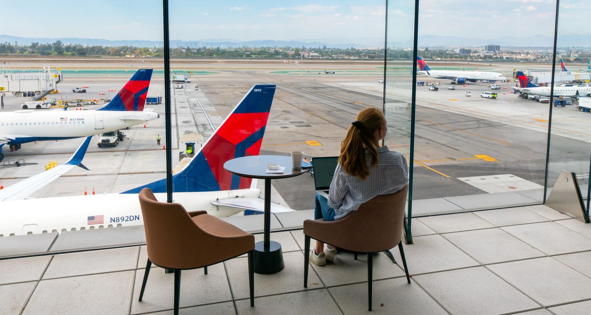 Airlines bank on splurging vacationers as clouds form on economy
