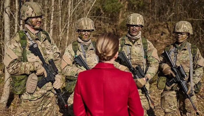 Denmarks Prime Minister Mette Frederiksen meets male conscripts in Jutland last week. —Reuters/File