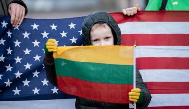 Lithuanians gather outside US Embassy to grieve American soldiers who died in training accident