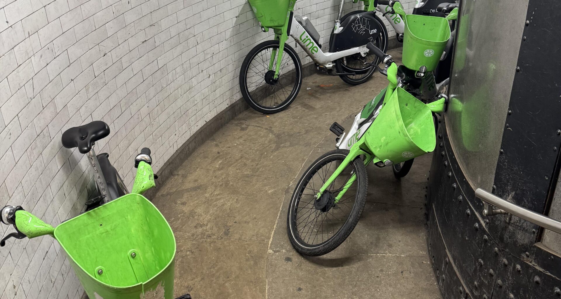 I'm getting really sick of Lime bikes blocking every footpath in this city. This is the state of Greenwich Foot Tunnel