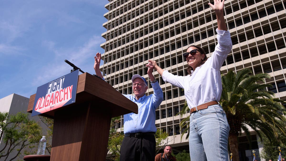 Sanders, AOC at outdoor political rally on podium