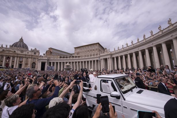 Pope Francis greets the faithful at the end of the Easter Mass led by Cardinal Angelo Comastri