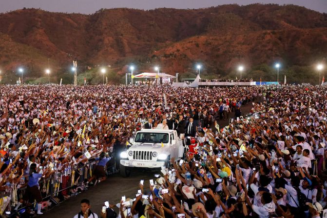 Pope Francis greets people from a car after <a href=