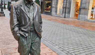 What can this gentleman be doing in Oviedo, Spain?.