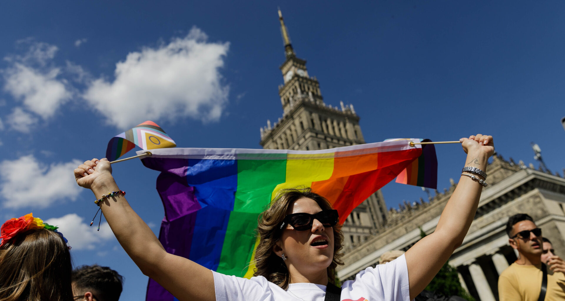 A participant holds a rainbow flag before the procession in Warsaw, Poland.