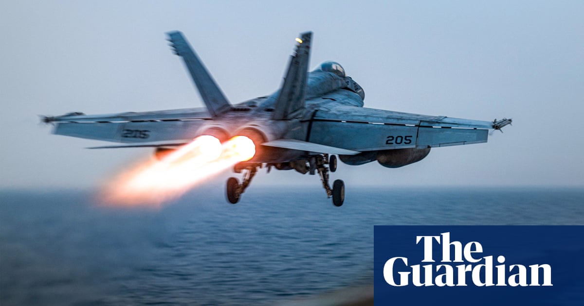 US fighter jet rolls off aircraft carrier as ship reportedly swerves Houthi fire | US military