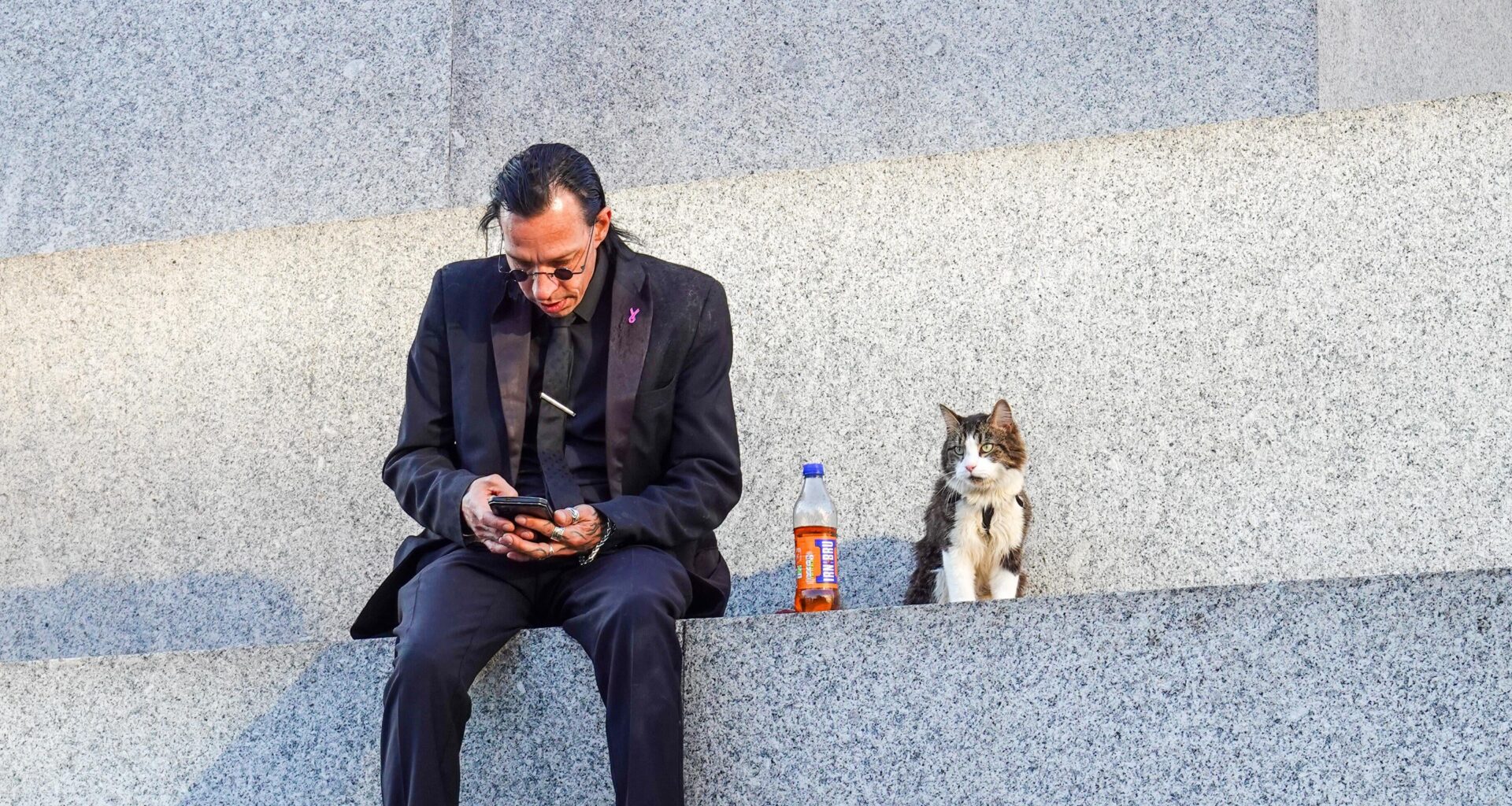 Just a man hanging out with his cat on Nelson’s column