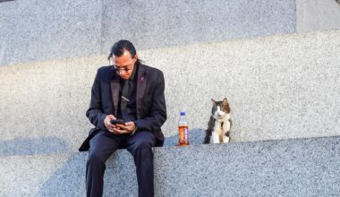 Just a man hanging out with his cat on Nelson’s column
