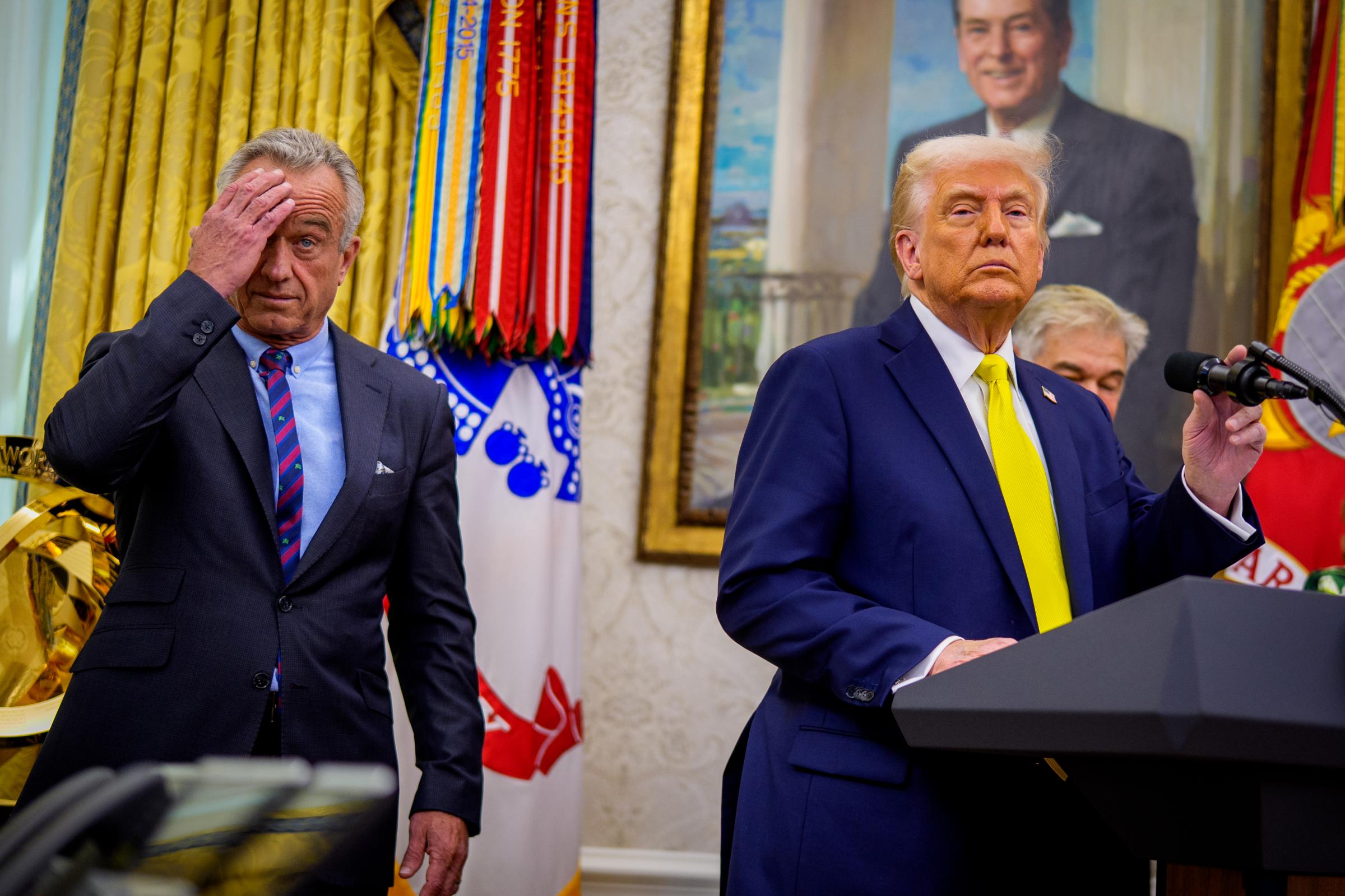 WASHINGTON, DC - APRIL 18: U.S. President Donald Trump, accompanied by Health and Human Services Secretary Robert F. Kennedy Jr. (L), takes a question from a reporter during a swearing in ceremony for Dr. Mehmet Oz as Medicare and Medicaid Services