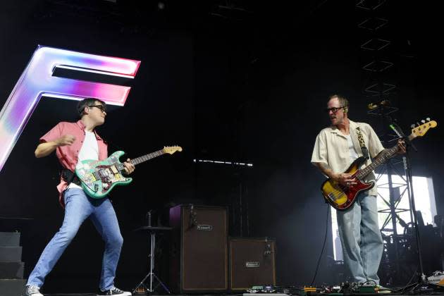 INDIO, CALIFORNIA - APRIL 12: (FOR EDITORIAL USE ONLY) (L-R) Rivers Cuomo and Scott Shriner of Weezer perform at the Mojave Tent during the 2025 Coachella Valley Music and Arts Festival at Empire Polo Club on April 12, 2025 in Indio, California. (Photo by Kevin Mazur/Getty Images for Coachella) - Credit: Kevin Mazur/Getty Images for Coachella