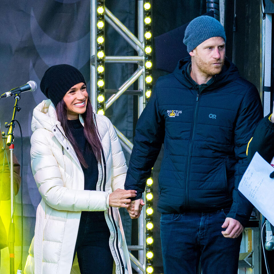 The Internet Reacts To Viral Video Of 'Controlling' Meghan Markle Grabbing Onto Prince Harry As He Kisses Another Woman: 'So Possessive'