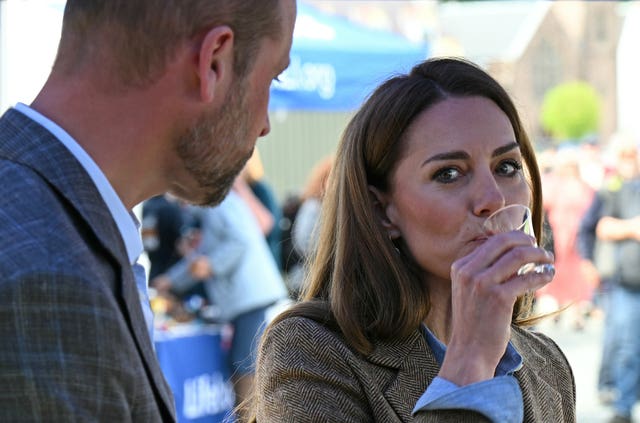 Kate samples some food and drink