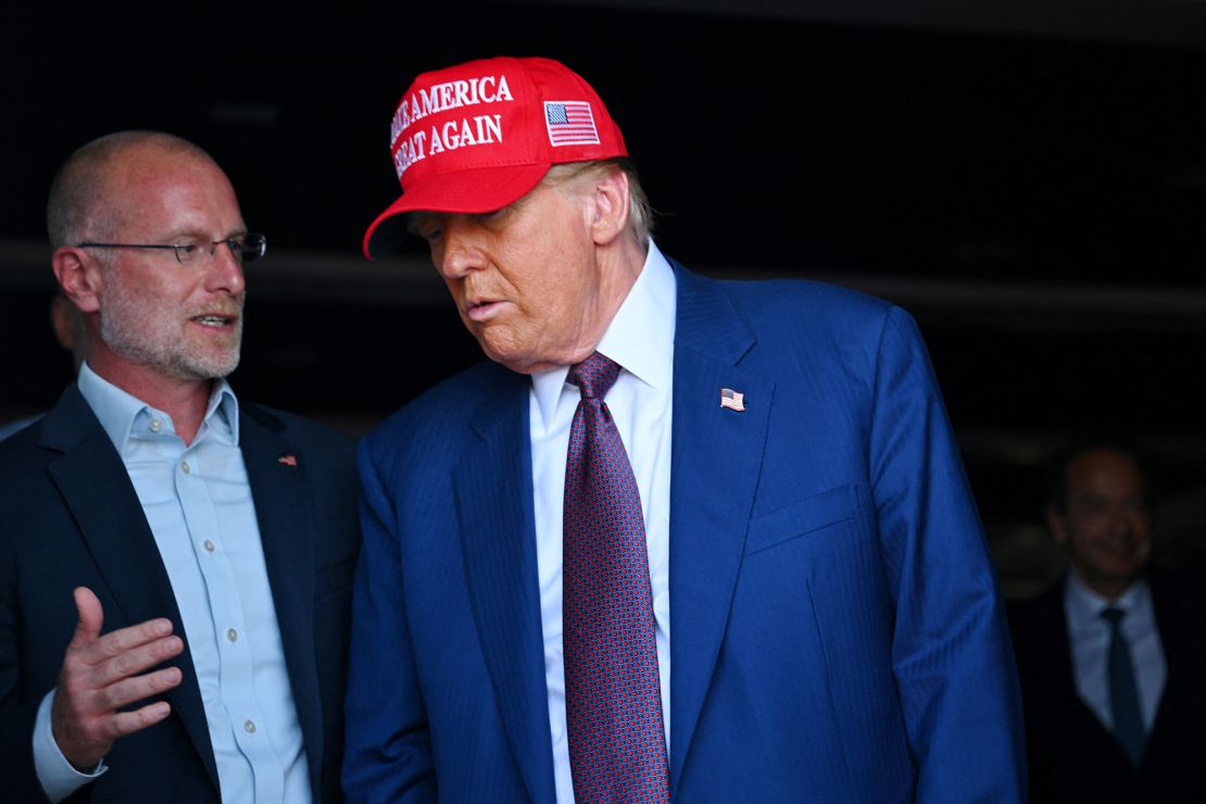 Then-President-elect Donald Trump speaks to Brendan Carr as he attends a viewing of the launch of the sixth test flight of the SpaceX Starship rocket in Brownsville, Texas, on November 19, 2024 .