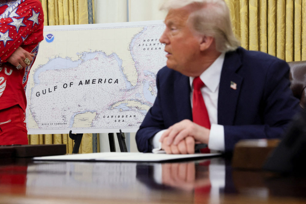 U.S. President Donald Trump signs an executive order in the Oval Office, in Washington