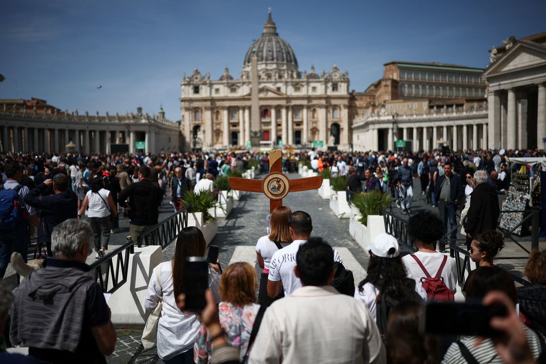 People gather in St. Peter's Square, after the death of Pope Francis was announced by the Vatican.