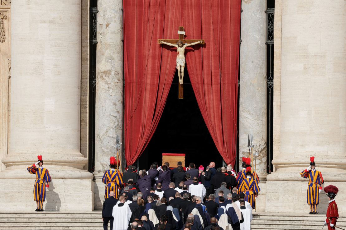 The coffin containing the body of Pope Francis is carried into St. Peter's Basilica.