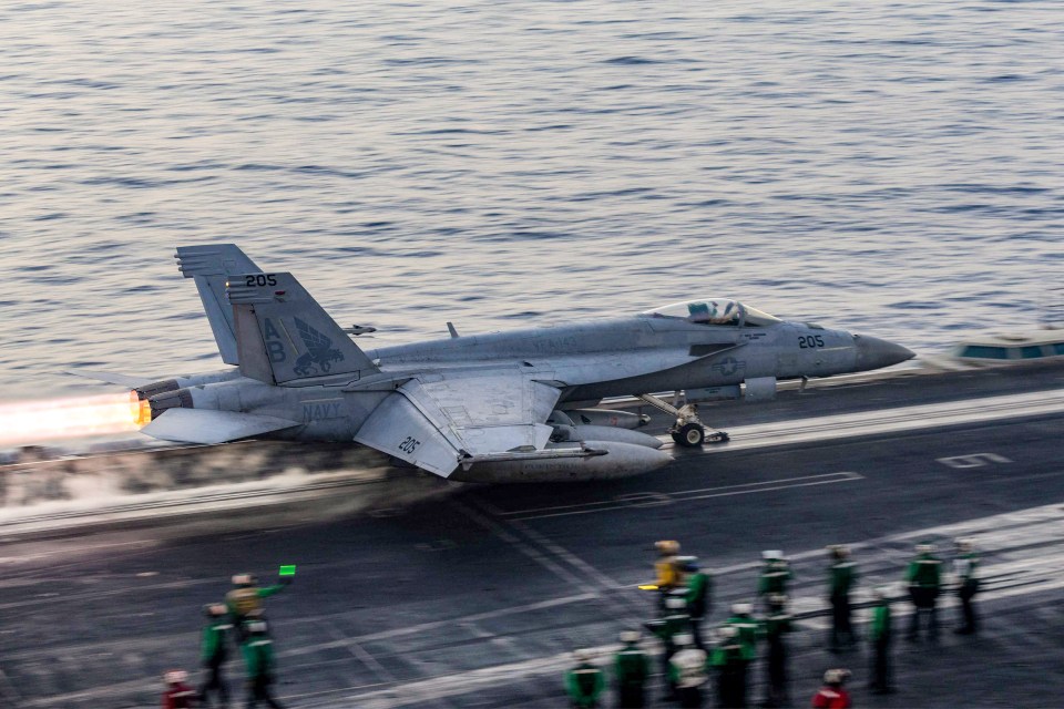 US Navy F/A-18 Super Hornet launching from aircraft carrier.