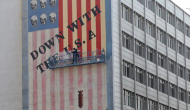 An Iranian painter repaints one of the famous anti-US murals in Tehran, Iran, 29 March 2025