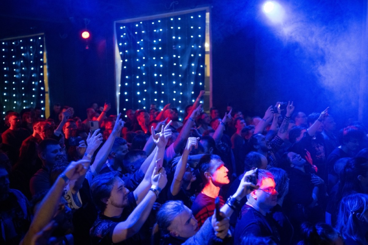 People attend a concert at a music club in Minsk.