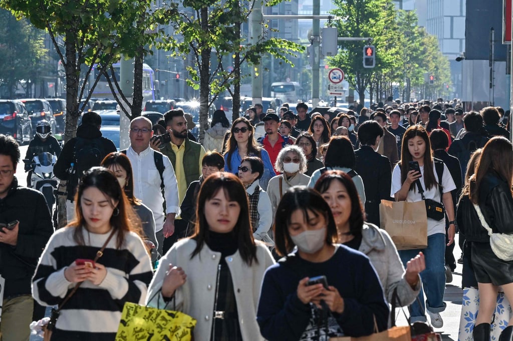 Pedestrians walk down the high-street shopping area of the Ginza district in central Tokyo. Trust in Japan among Southeast Asian states has increased. Photo: AFP