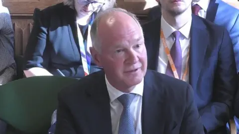 PA Media Heathrow chief executive Thomas Woldbye wears a suit and tie while talking MPs