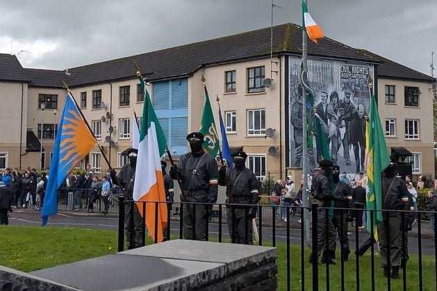 Police attacked with petrol bombs as masked men lead New IRA parade through Derry