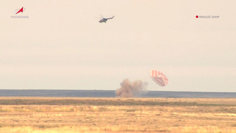 The Soyuz MS-26 space capsule carrying the International Space Station (ISS) crew lands in a remote area of Kazakhstan