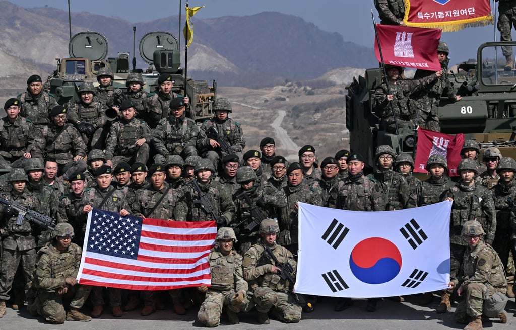 South Korean and US soldiers pose for photos after a joint live-fire exercise at a military training field in South Korea last year. Photo: Reuters South Korean and US soldiers pose for photos after a joint live-fire exercise at a military training field in South Korea last year. Photo: Reuters