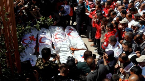 Bodies of Palestinian rescue workers recovered from mass grave – video