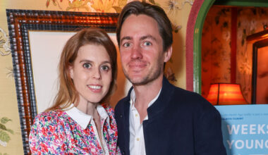 Princess Beatrice wearing a floral dress smiling and standing next to Edoardo Mapelli Mozzi
