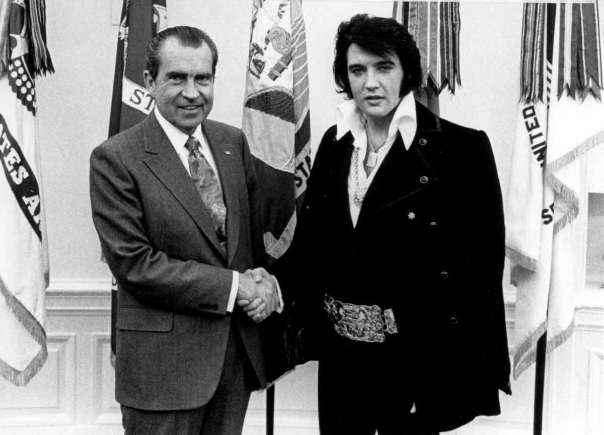 Then US president Richard Nixon meeting Elvis Presley in the Oval Office on December 21, 1970, when Elvis was presented with a Bureau of Narcotics and Dangerous Drugs badge. Nixon had coined the term ‘war on drugs’ in a speech six months earlier. Picture: US National Archives
                    