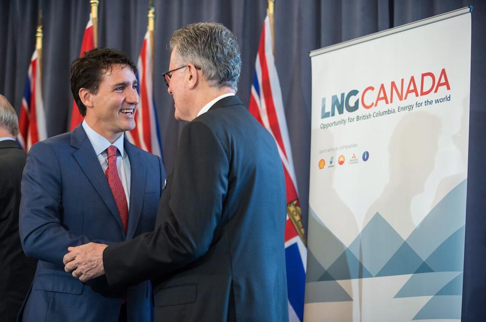 Prime Minister Justin Trudeau, left, and LNG Canada CEO Andy Calitz speak after an LNG Canada news conference in Vancouver on Oct. 2, 2018. LNG Canada announced that its joint venture participants Shell, PETRONAS, PetroChina, Mitsubishi Corporation and KOGAS made a final investment decision to build the LNG Canada export facility in Kitimat, B.C. on Monday.