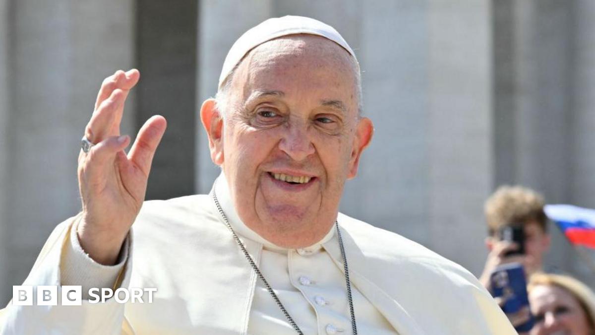 Pope Francis greets visitors at the Vatican