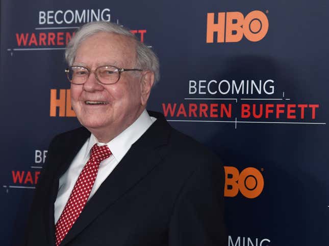 Warren Buffett on a red carpet in front of an HBO backdrop that says "Becoming Warren Buffett"