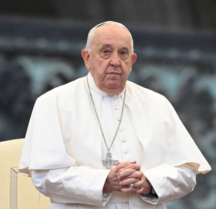 Pope Francis in traditional attire standing outdoors