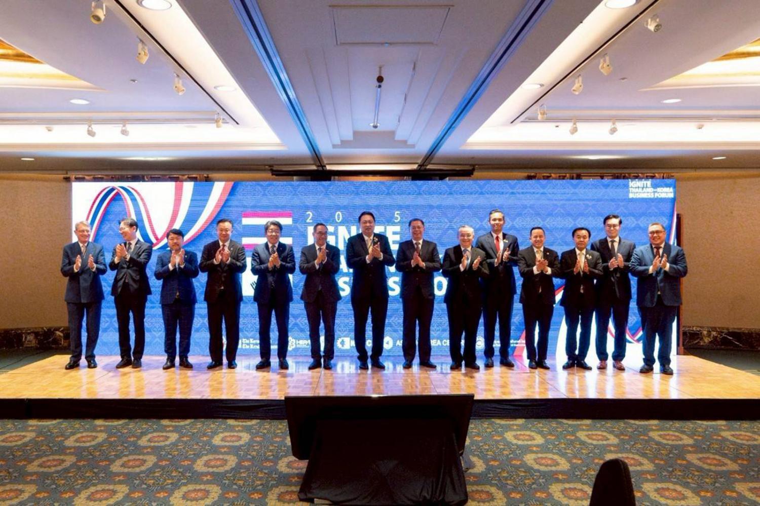 Deputy Minister of Commerce, Suchart Chomklin, seventh left, poses for a group photo with Thai and Korean delegates at the '2025 Ignite Thailand-Korea Business Forum' in Seoul. Poramet Tangsathaporn