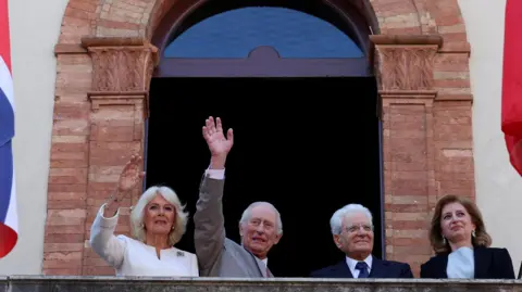 Reuters Britain's King Charles, Queen Camilla and President of Italy, Sergio Mattarella and his daughter and first lady of Italy Laura Mattarella wave outside the town in hall in Ravenna. 