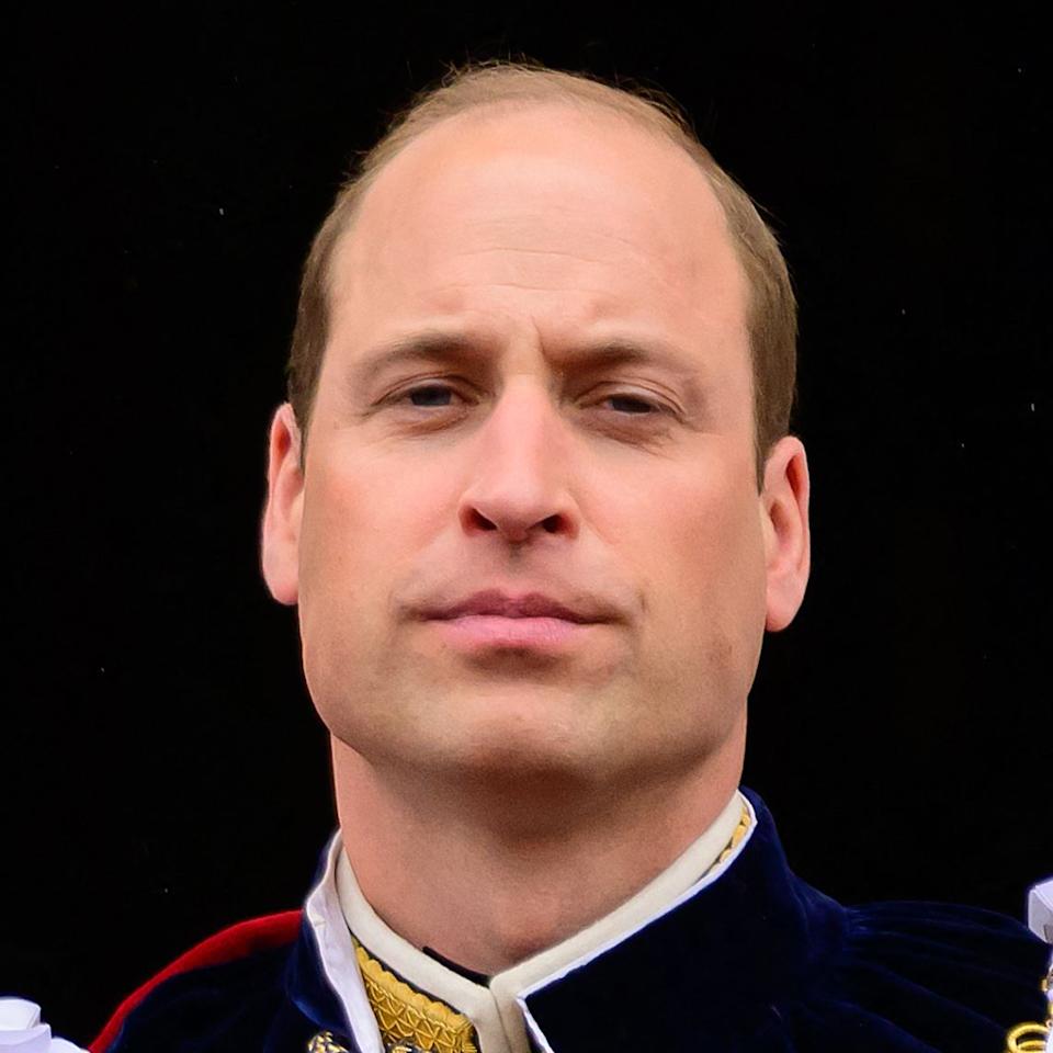 Prince William stares at the camera.