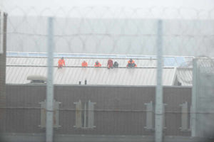 Prisoners on the roof at HMP Oakwood in November 2013