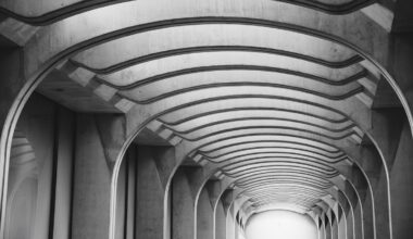 A black and white photo of a modern corridor