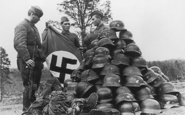 Soviet troops displaying spoils of war