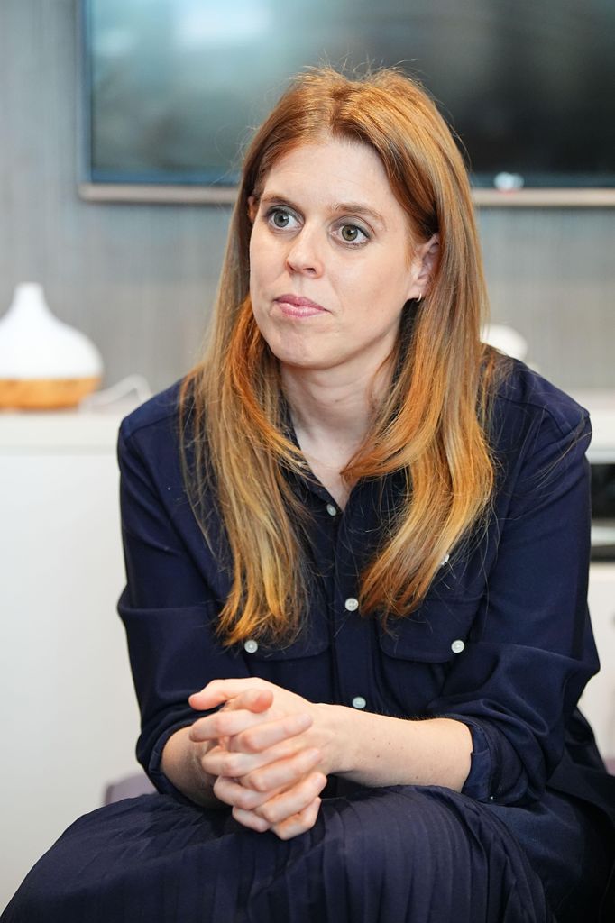 Princess Beatrice in a navy-coloured dress