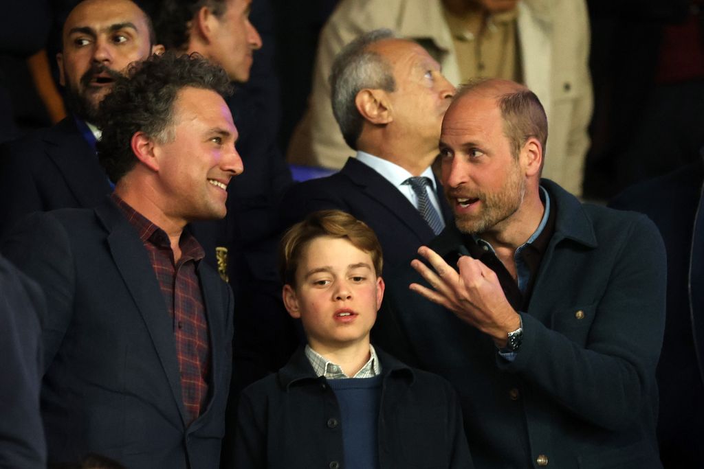 Thomas van Straubenzee, Prince George of Wales and Prince William, Prince of Wales interact in the stands during the UEFA Champions League 2024/25 Quarter Final First Leg match between Paris Saint-Germain and Aston Villa FC at Parc des Princes on April 09, 2025 in Paris, France.