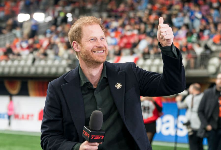 VANCOUVER, CANADA – NOVEMBER 17: Prince Harry acknowledges fans prior to the start of a TV interview during pre-game festivities before the start of the 2024 Grey Cup at BC Place on November 17, 2024 in Vancouver, Canada. (Photo by Rich Lam/Getty Images)